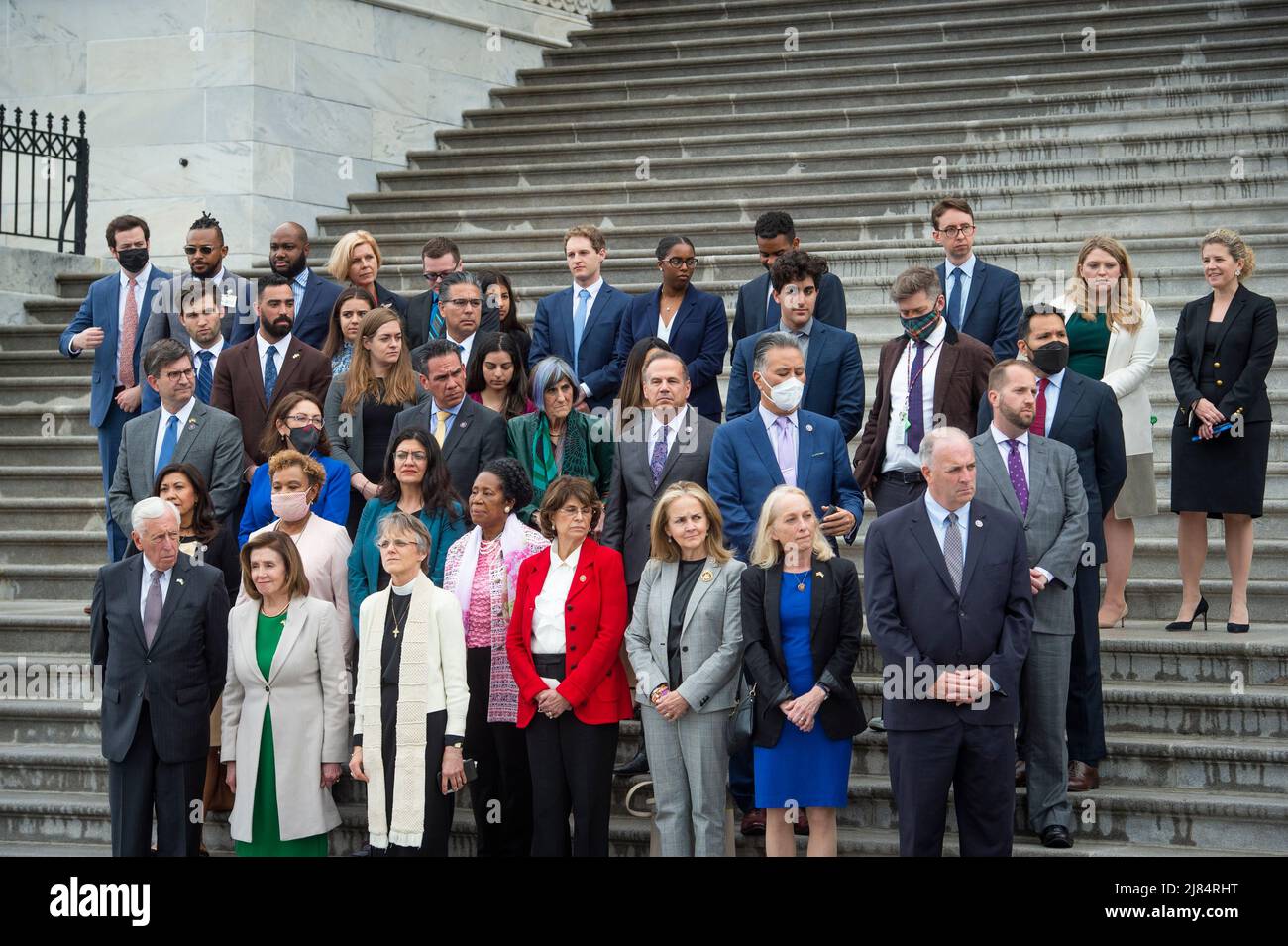 United States House Majority Leader Steny Hoyer (Democrat of Maryland), left, Speaker of the United States House of Representatives Nancy Pelosi (Democrat of California), second from left, and Bishop Mariann Edgar Budde of the Episcopal Diocese of Washington, third from left, lead Democratic members of the House of Representatives during a Moment of Silence for the One Million American Lives Lost to COVID-19, on the East Front Center Steps at the US Capitol in Washington, DC, Thursday, May 12, 2022. Credit: Rod Lamkey/CNP /MediaPunch Stock Photo