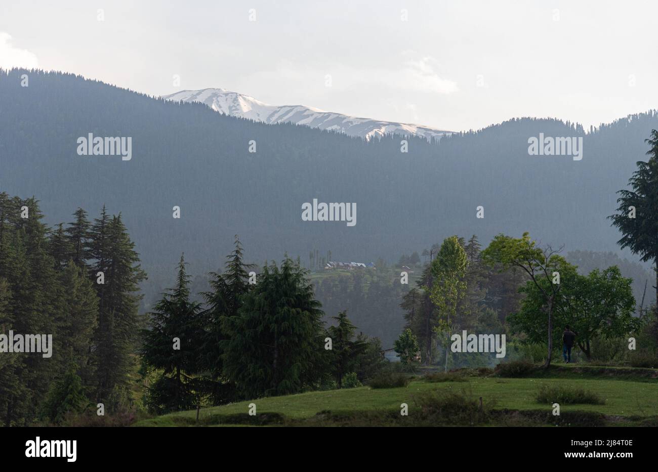 A view of snow capped mountain peak during a sunny day. (Photo by ...