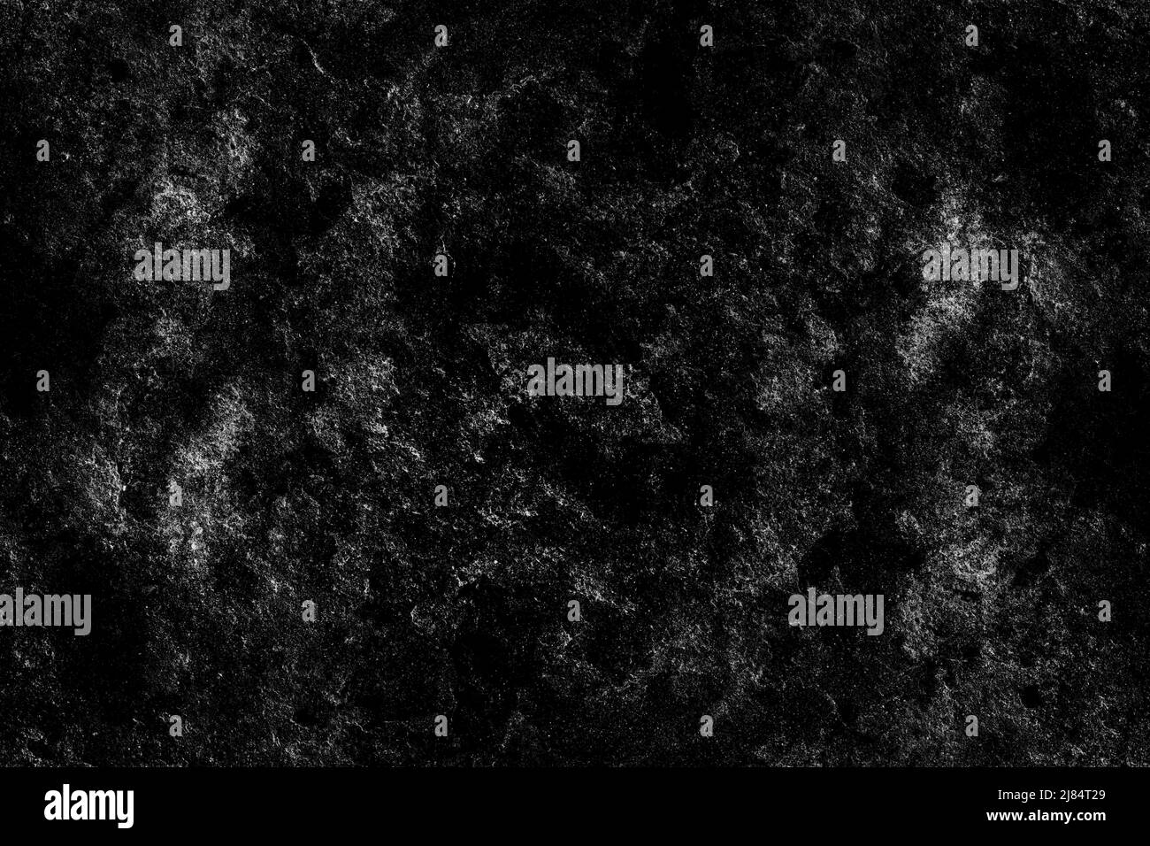Abstract textured dark stone wall surface with heavy grunge texture ...