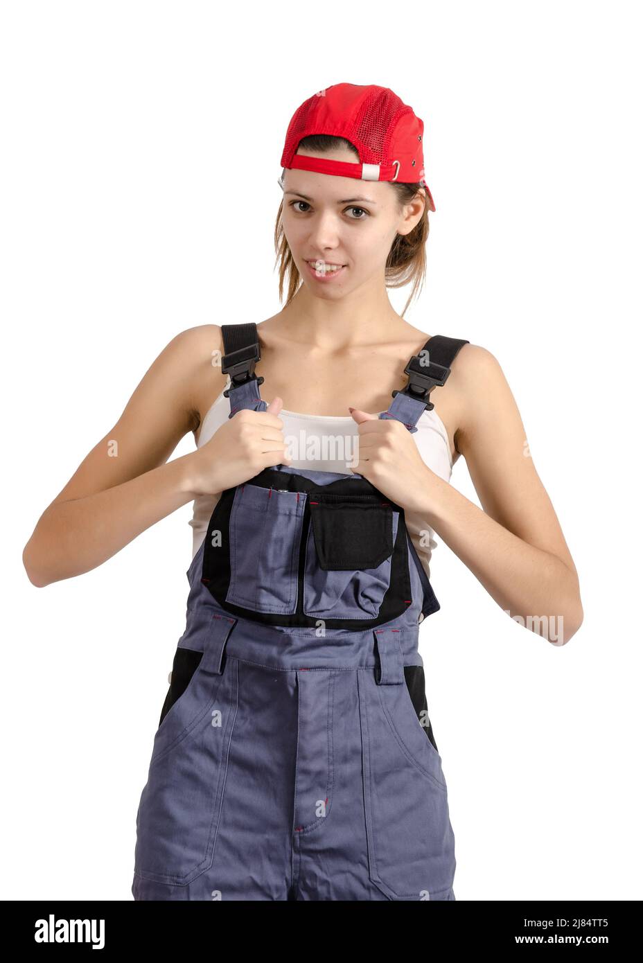 Young girl in overalls. Isolated on white Stock Photo