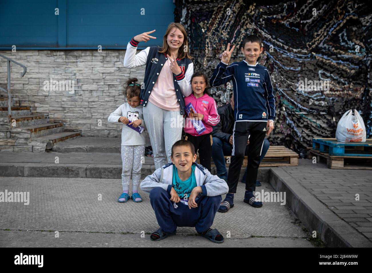 Sophia (L), Valeria and their siblings who fled from Kherson pose for a photo outside an underground shelter. Temporary refugee shelters have been set up in Zaporizhia, as the city has been constantly receiving refugees fleeing from Russian controlled territories in the country's east and south.According to the United Nations, more than 11 million people are believed to have fled their homes in Ukraine since the conflict began, with 7.7 million people displaced inside their homeland. (Photo by Alex Chan Tsz Yuk/SOPA Images/Sipa USA) Stock Photo