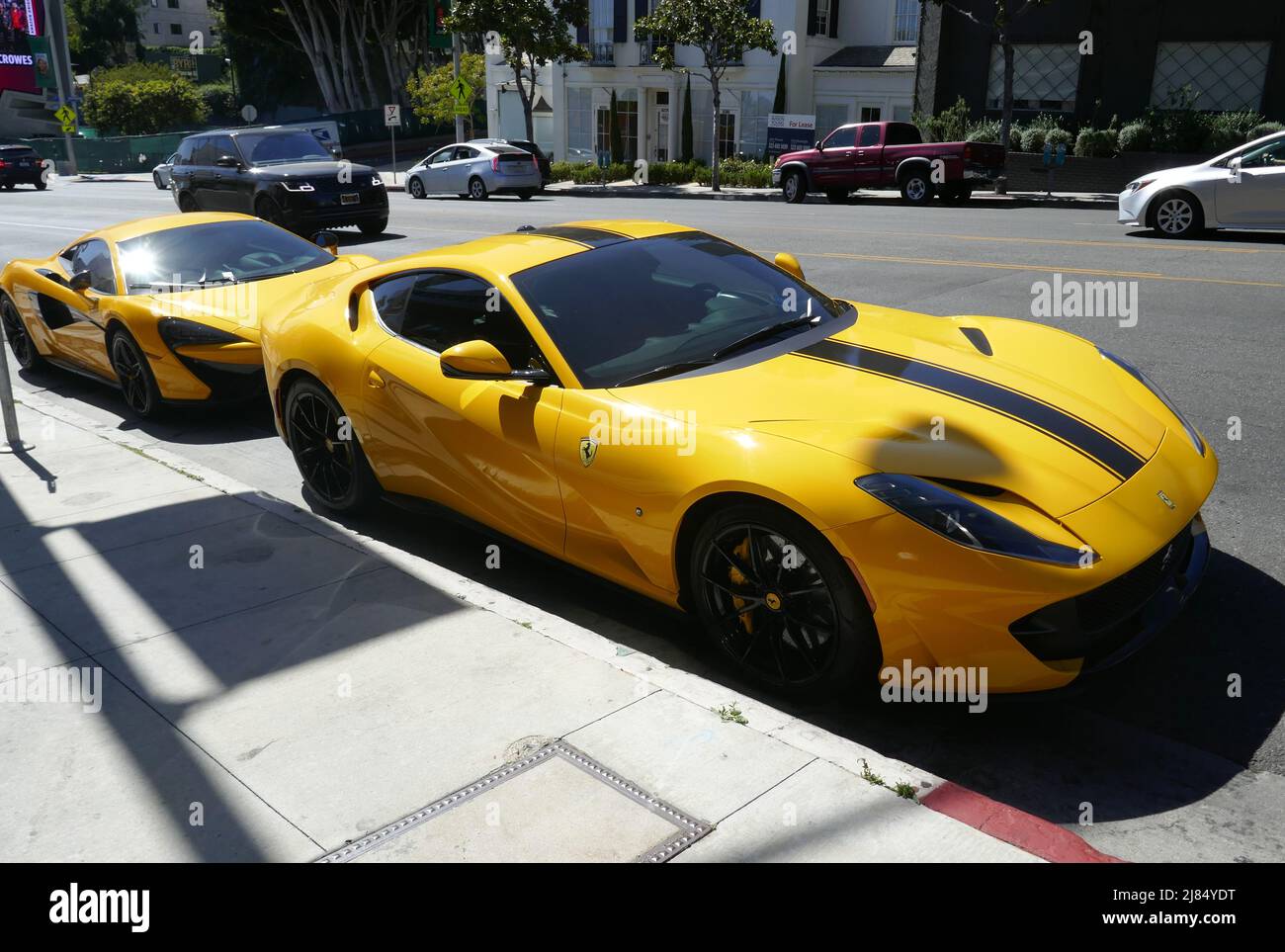 Los Angeles, California, USA 12th May 2022 A general view of atmosphere of Yellow McLaren and Yellow Ferrari on Sunset Blvd on May 12, 2022 in Los Angeles, California, USA. Photo by Barry King/Alamy Stock Photo Stock Photo