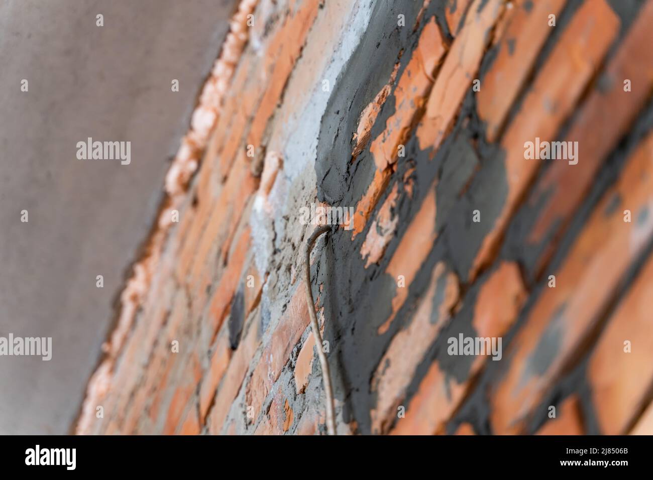 The wire runs through the wall. Mortgage for wiring. Freshly laid brick