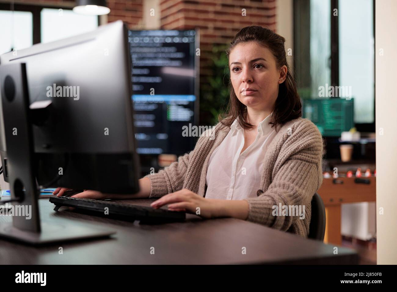 Software developer engineering an autonomous defence system using advanced artificial intelligence technology. Cyber officer encrypting big chunks of data in order to secure important files. Stock Photo