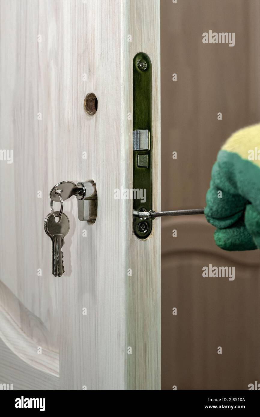 Installing a lock on a wooden door. Installation and replacement of the