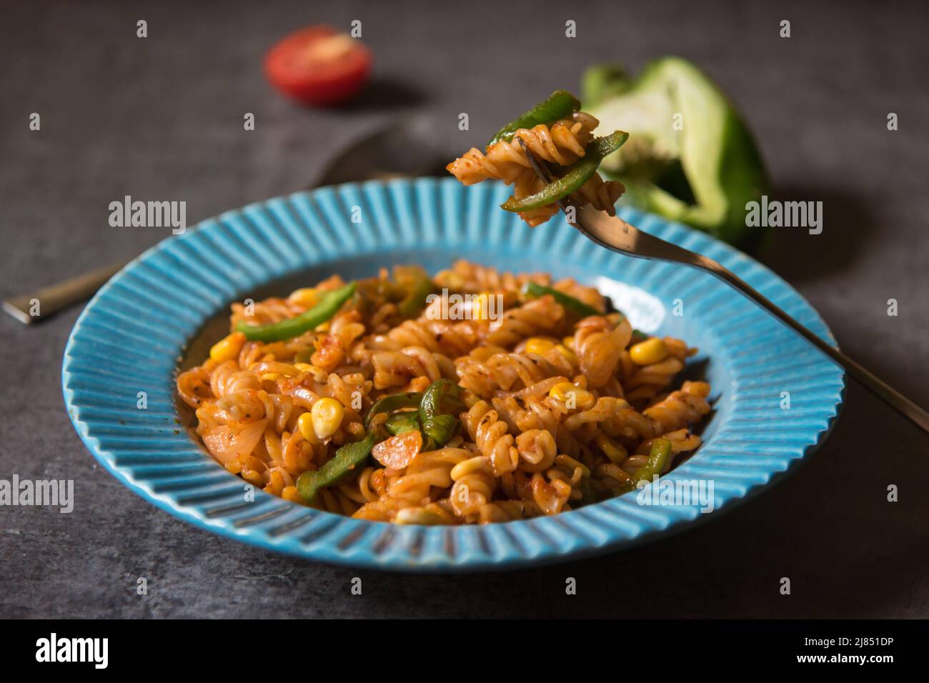 Close up of cooked food on fork with use of selective focus Stock Photo