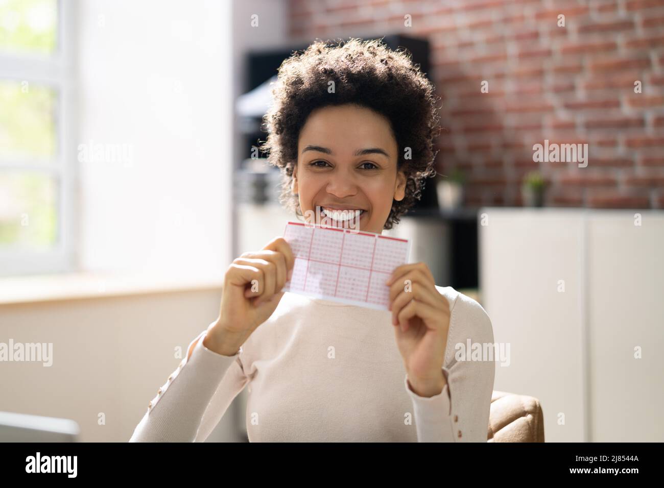 African Lottery Winner Person With Lotto Ticket Stock Photo