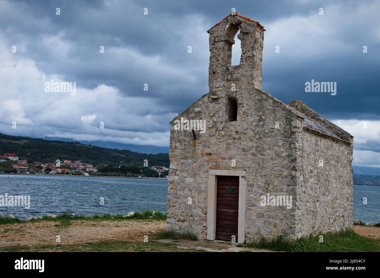 Little medieval stone church on rainy day Stock Photo - Alamy