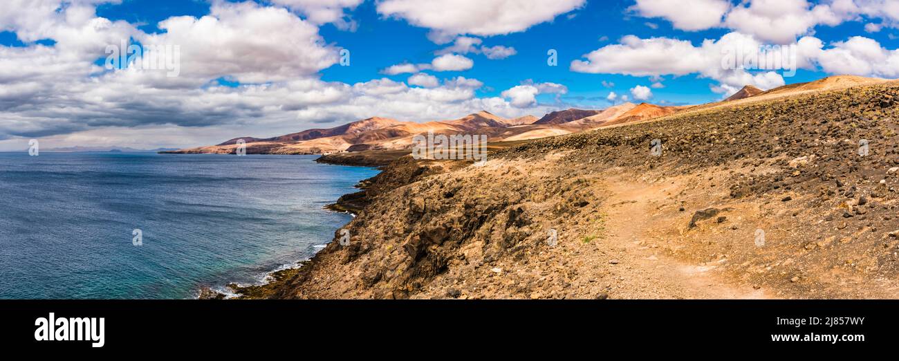 Panorama from Puerto Calero to Playa Quemada, Lanzarote, Spain with Fuerteventura in the distance Stock Photo