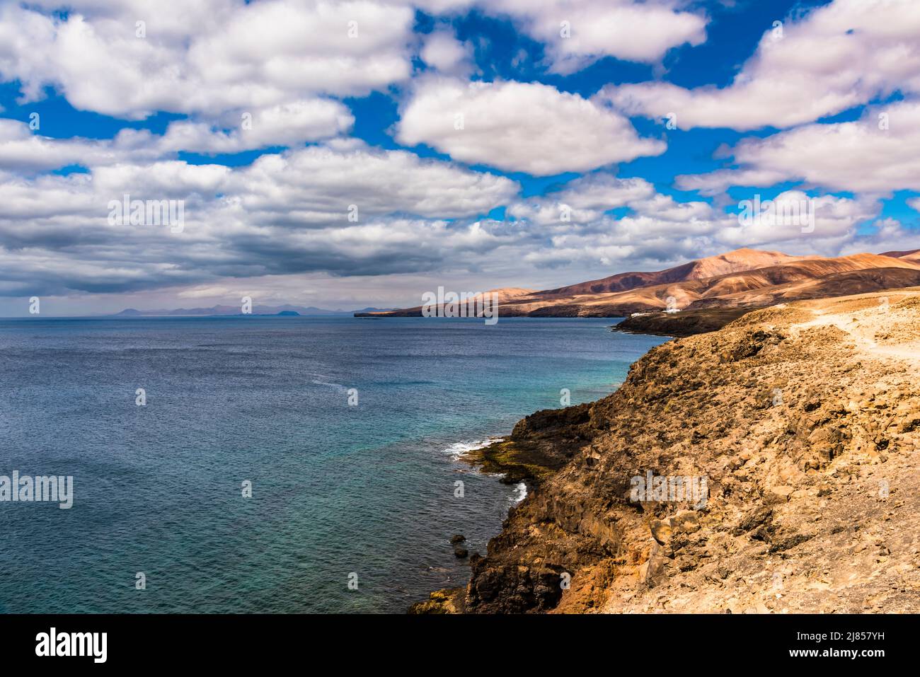 Panorama from Puerto Calero across to Playa Quemada, Lanzarote, Spain with Fuerteventura in the distance Stock Photo