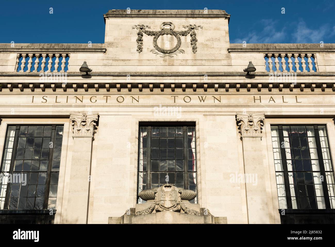 The front facade of Islington Town Hall, Upper Street, Islington, London, UK on a sunny, spring evening Stock Photo