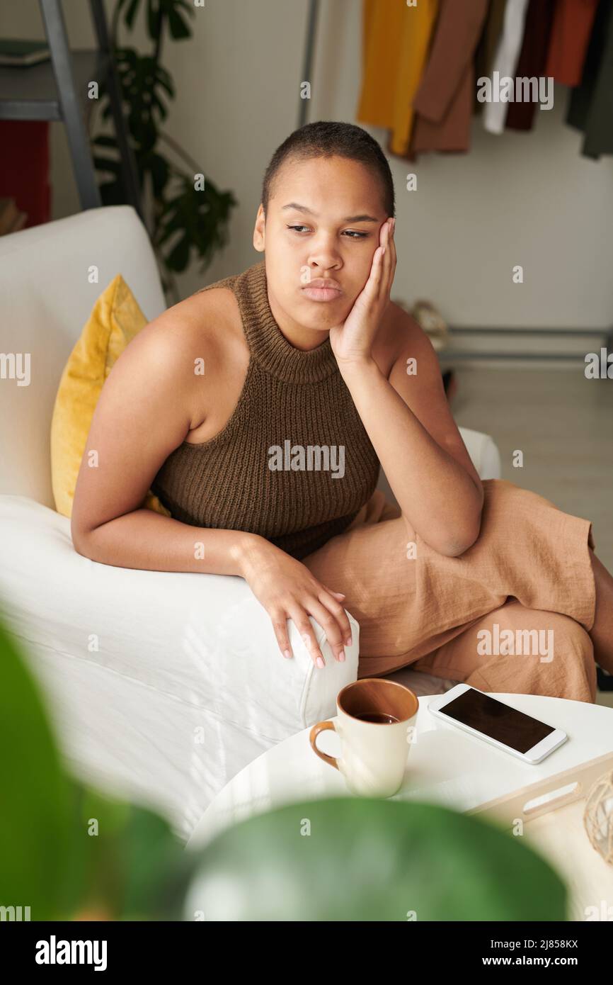 Woman in black top indoors hi-res stock photography and images - Alamy