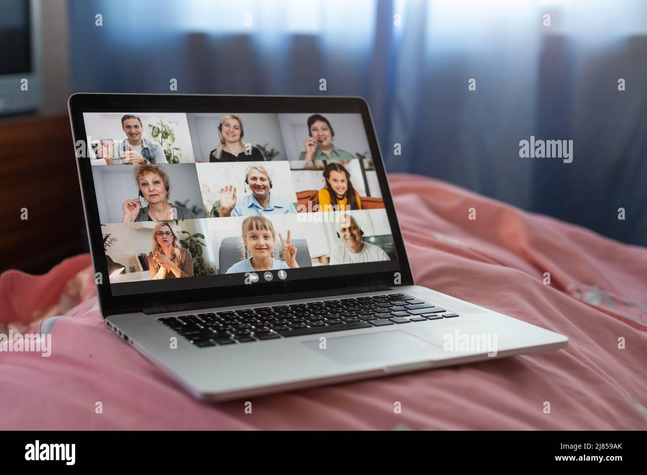 distance video group conference call in bedroom. fun chatting during virtual meeting at home