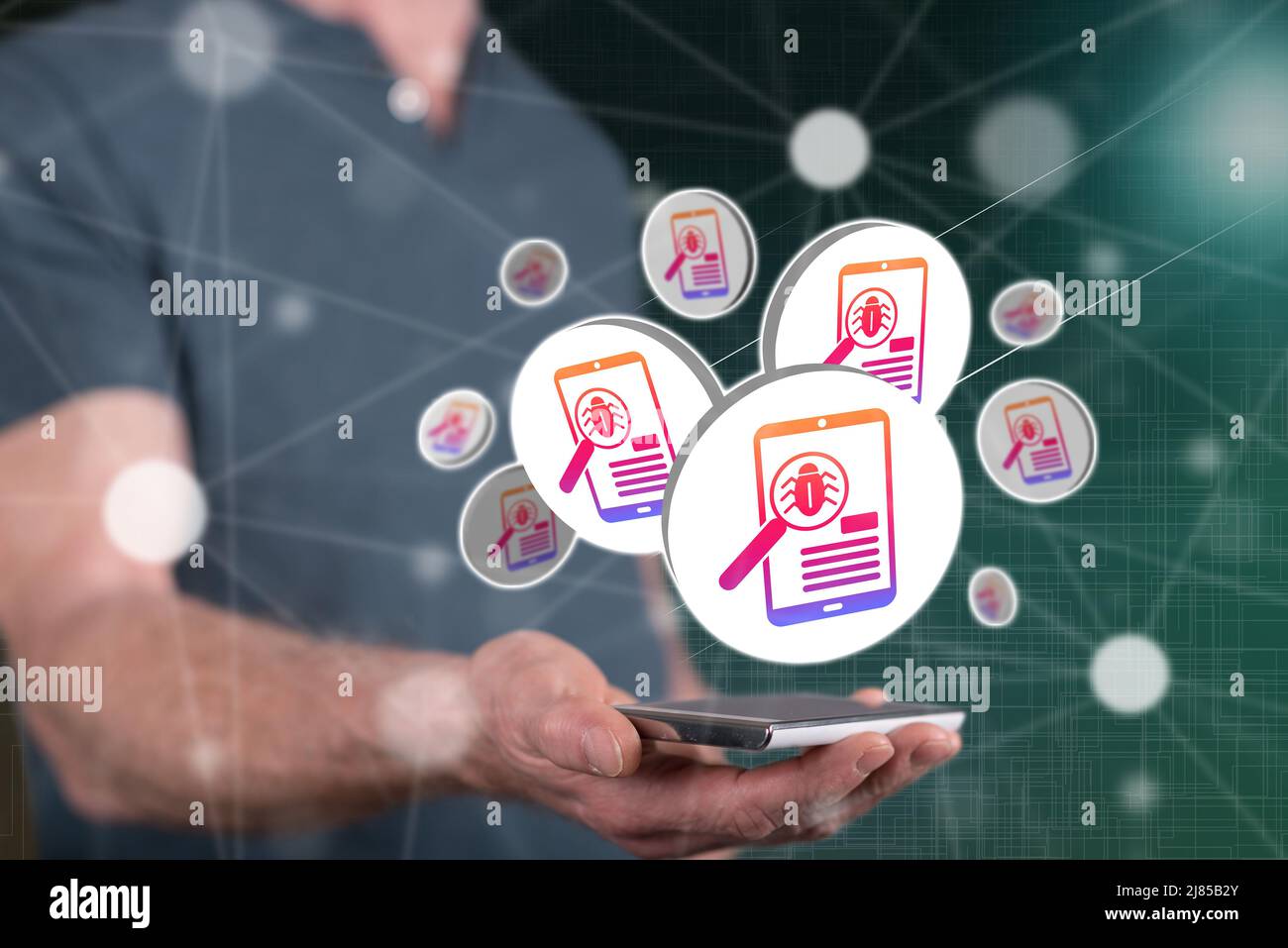 Software testing concept above a smartphone held by a man in background Stock Photo