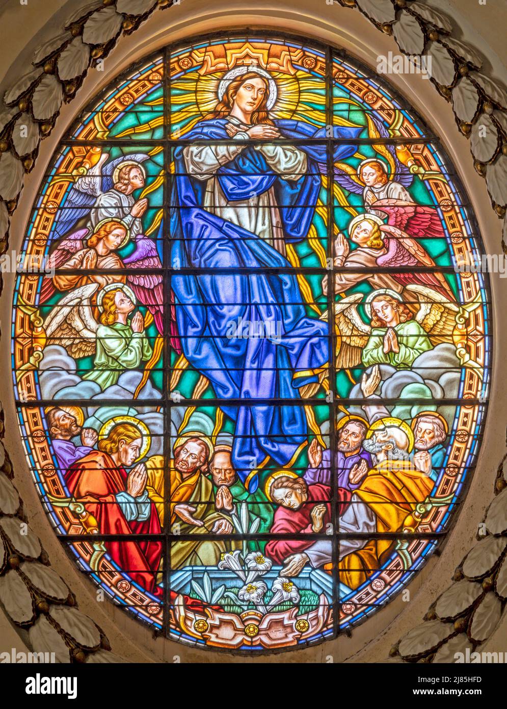 VALENCIA, SPAIN - FEBRUAR 14, 2022: The Assumption in stained glass of the Cathedral by Arte S.A. from  Bilbao (1962). Stock Photo