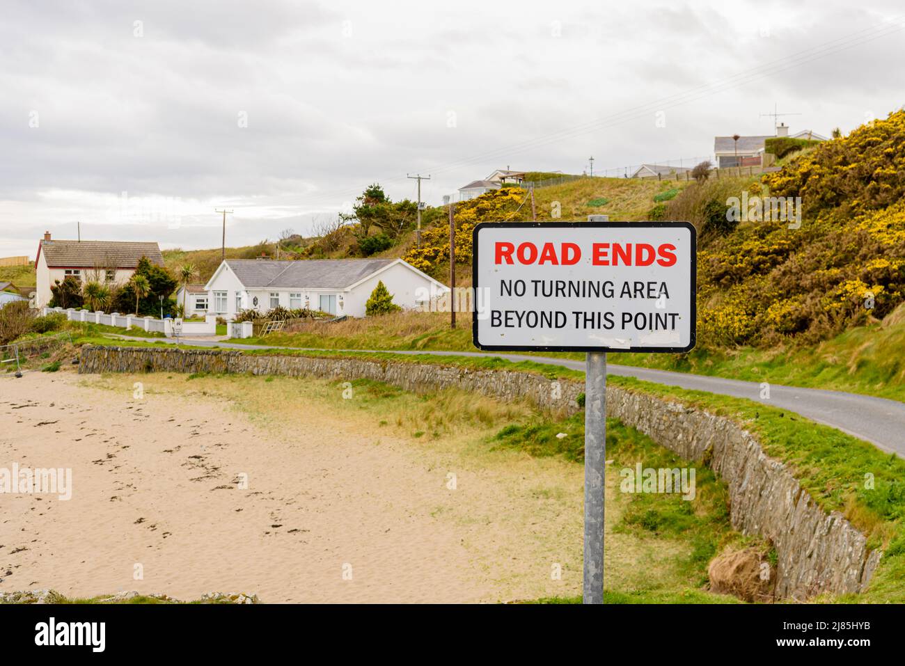 Sign on a coastal road which reads 'Road Ends.  No turning area beyond this point' Stock Photo