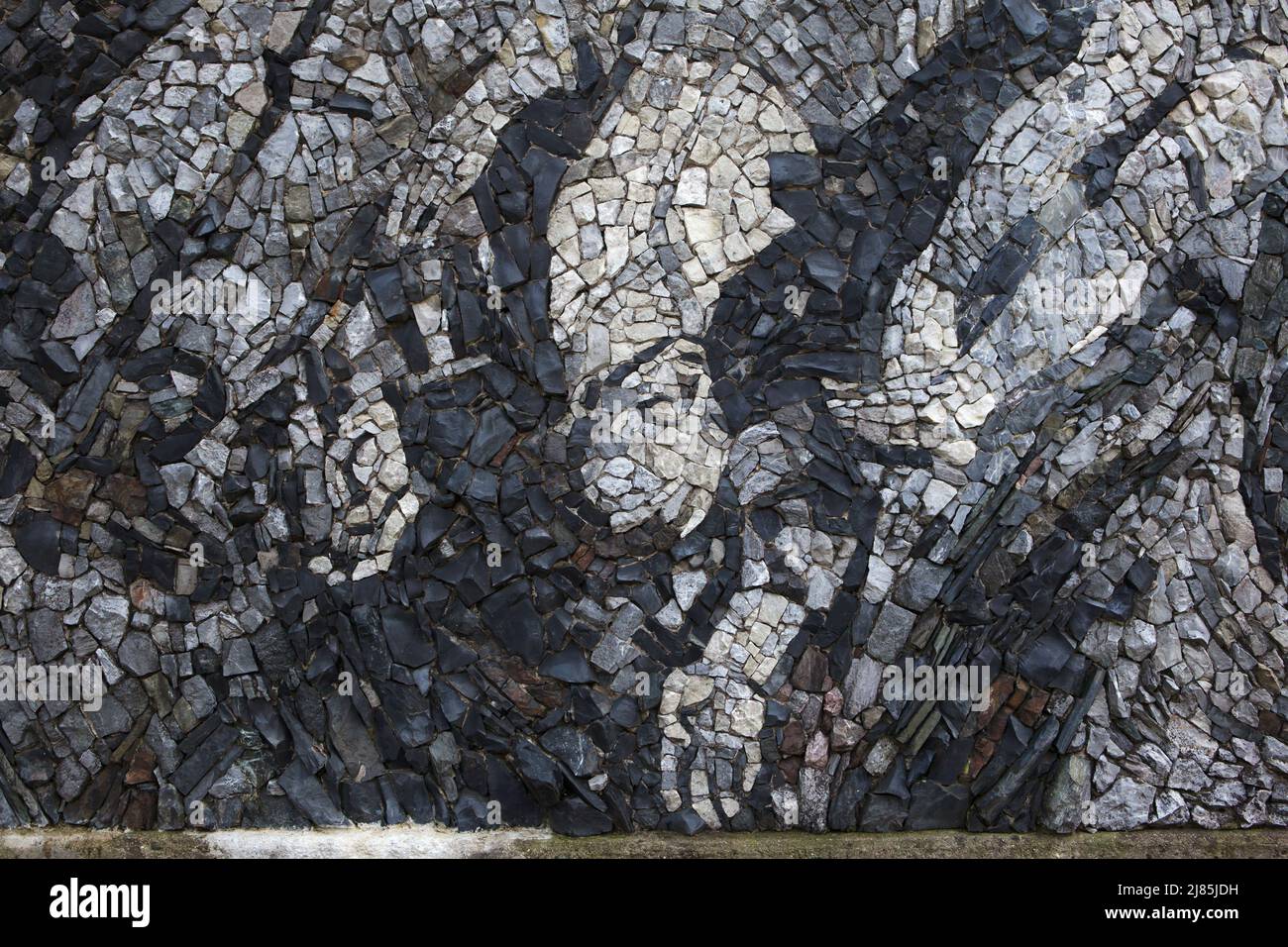 Executed victims of the Nazi occupation depicted in the detail of the stone mosaic designed by Czech modernist artist Martin Sladký in the area of the Kobylisy Shooting Range (Kobyliská střelnice) in Prague, Czech Republic. The area of the former military shooting range was used for mass executions during the Nazi occupation. Stock Photo