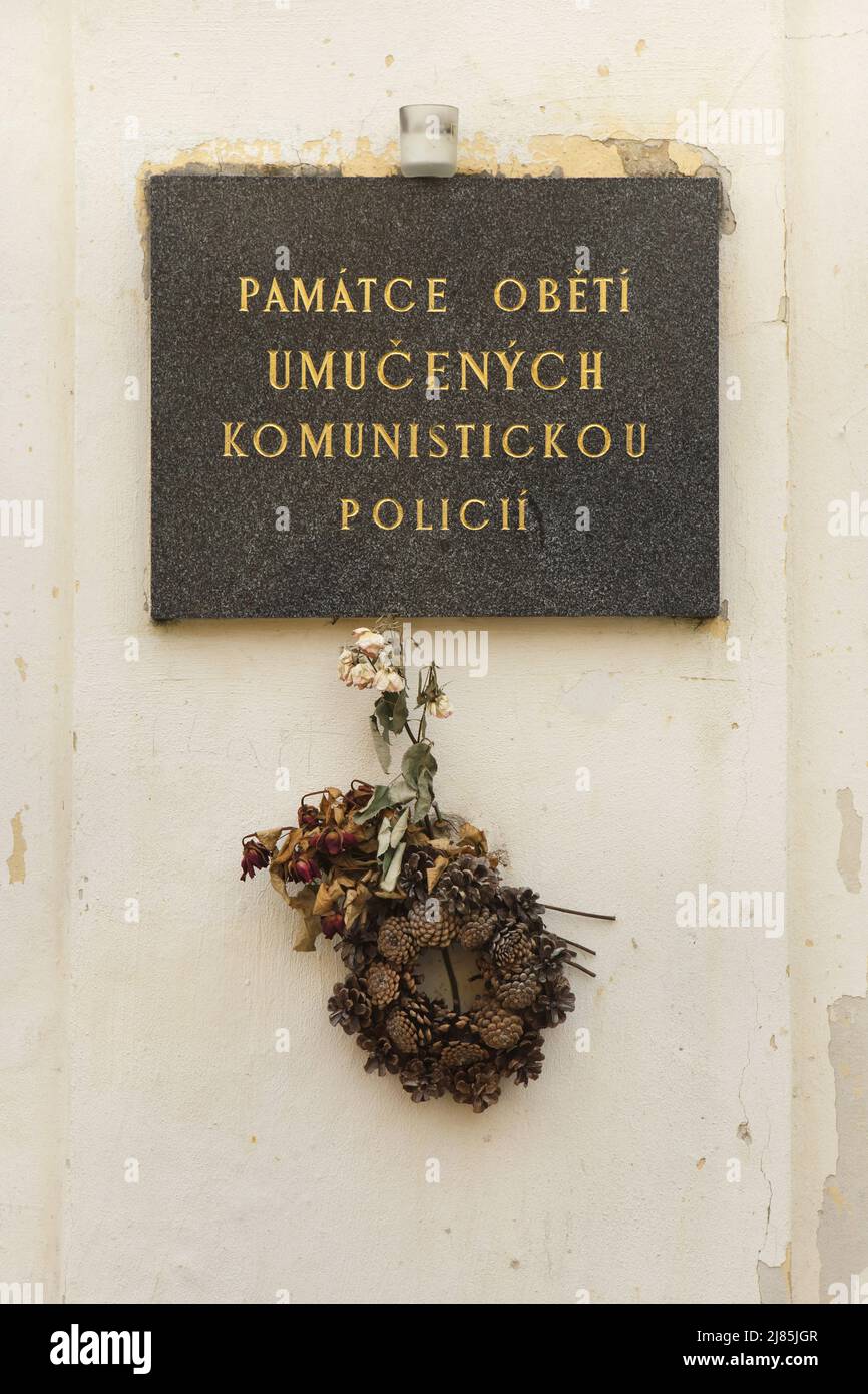 Commemorative plaque devoted to the memory of victims tortured by the Czechoslovakian communist police in Kapucínská Street in Hradčany district in Prague, Czech Republic. The plaque is installed on the wall of the area where the former prison of the Czechoslovakian secret police (StB) known as the Domeček (Hradčanský domeček) is located. Stock Photo