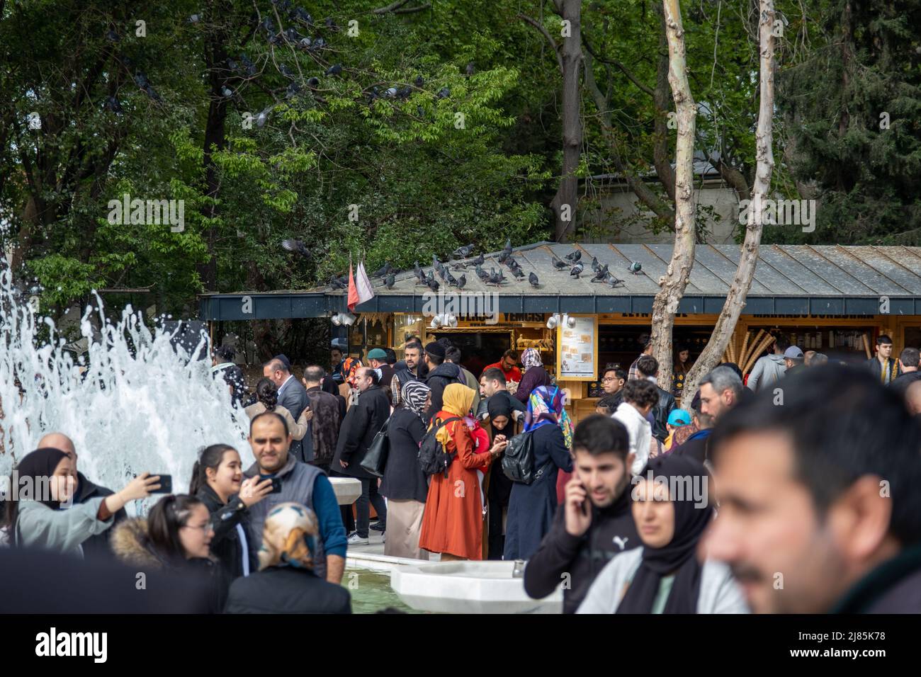 A lot of people in the Eyup Sultan Mosque courtyard, Islamic culture and place, editorial Eyüpsultan Camii Stock Photo