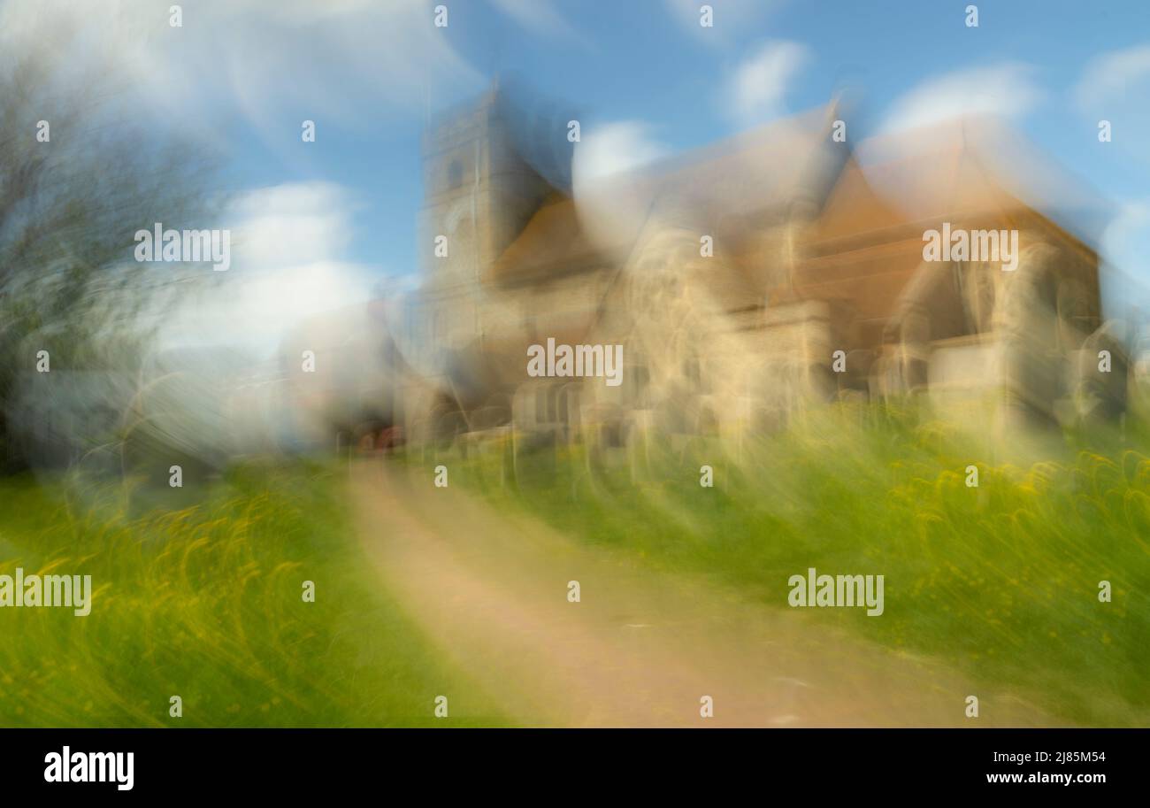 Impression of St Leonards church and churchyard in the morning sun. Stock Photo