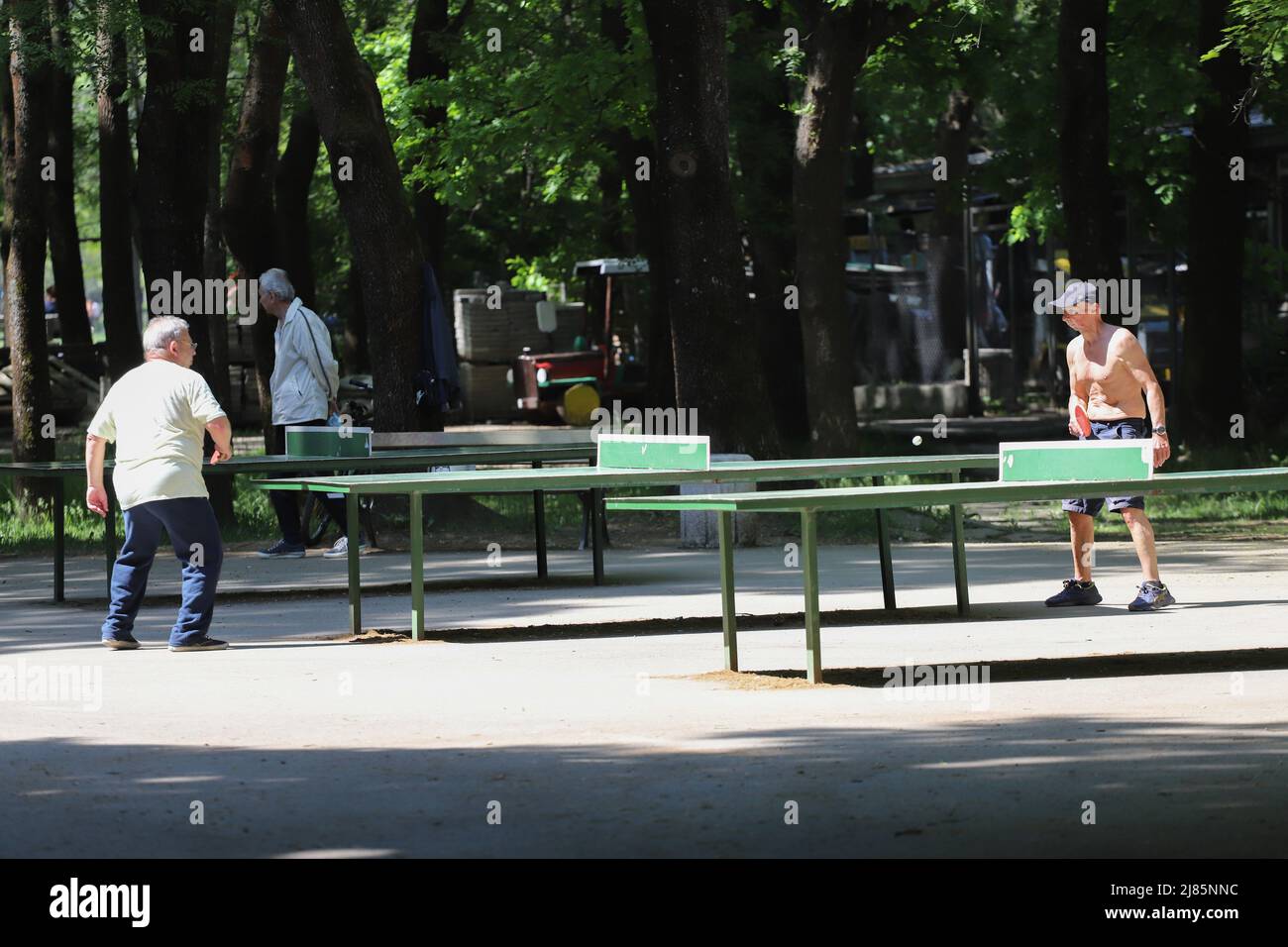 People play table tennis in the park in Sofia, Bulgaria on 05/13/2022