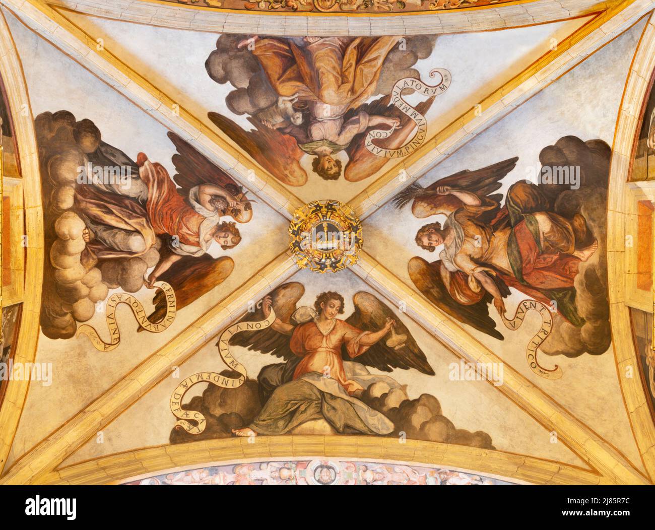 VALENCIA, SPAIN - FEBRUARY 15, 2022:  The ceiling fresco of angels with the eucharist atributs in the church Iglesia del Patriarca Stock Photo