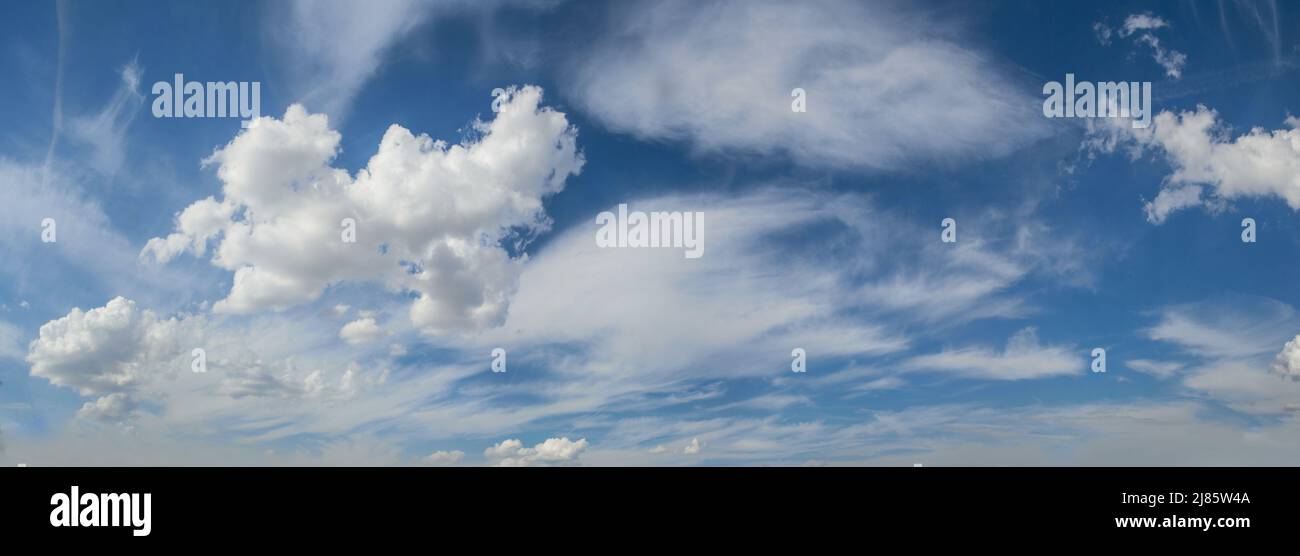 Vivid blue sky with white clouds panoramic background Stock Photo - Alamy