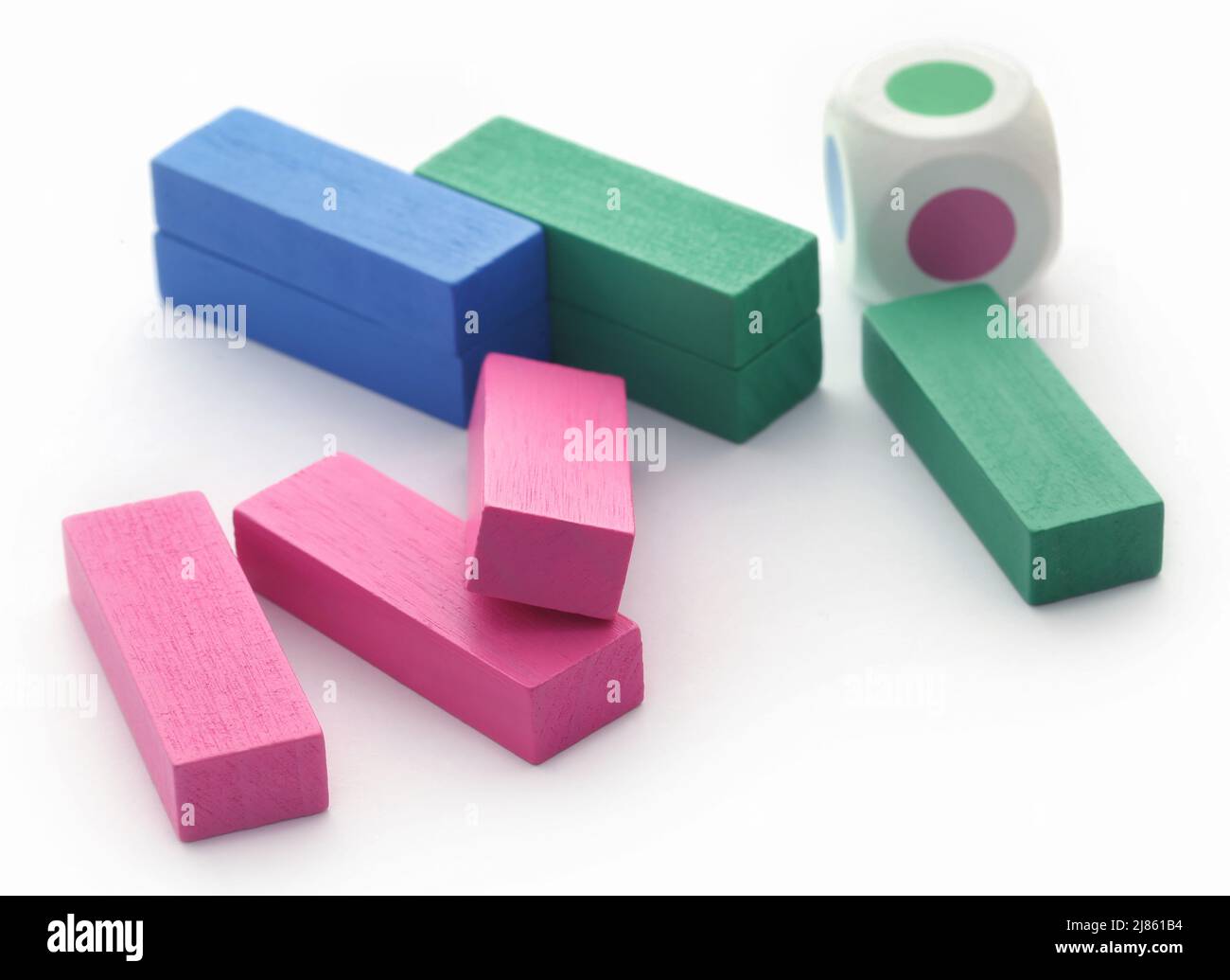 Jenga game of colorful wooden blocks over white background Stock Photo
