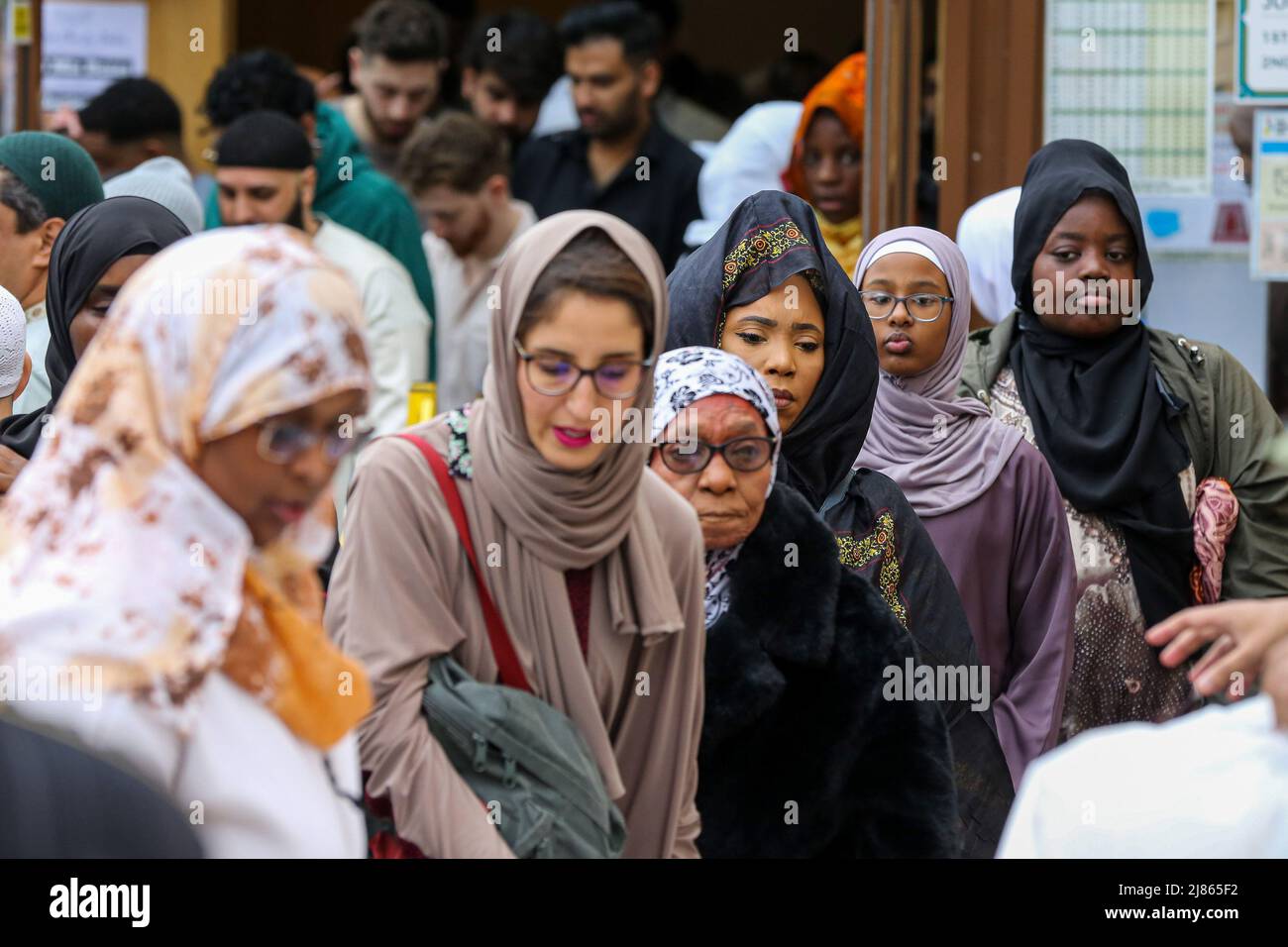 Muslim women leave a mosque after attending morning prayers Stock Photo ...