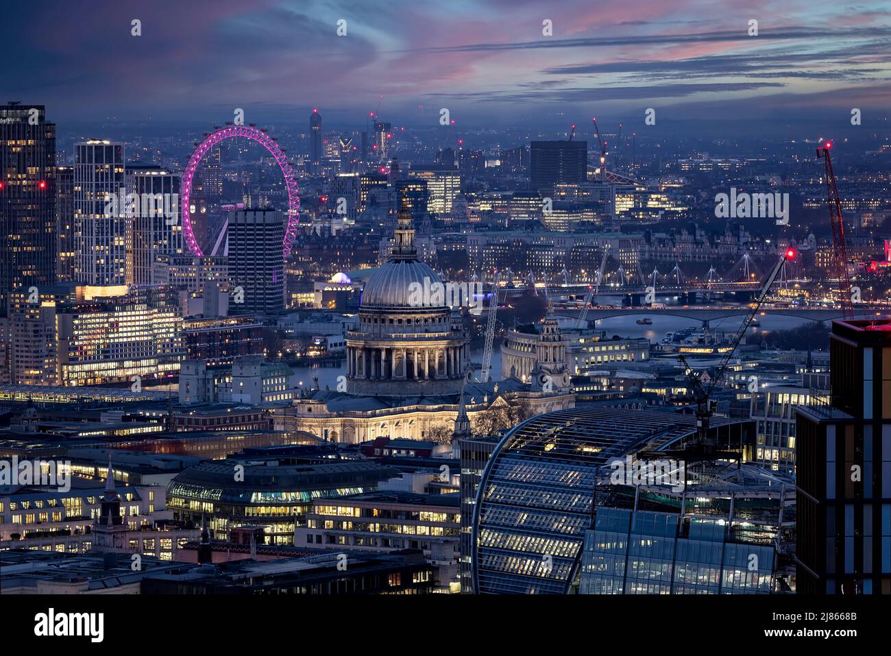 Elevated, panoramic view of the illuminated skyline of London Stock ...