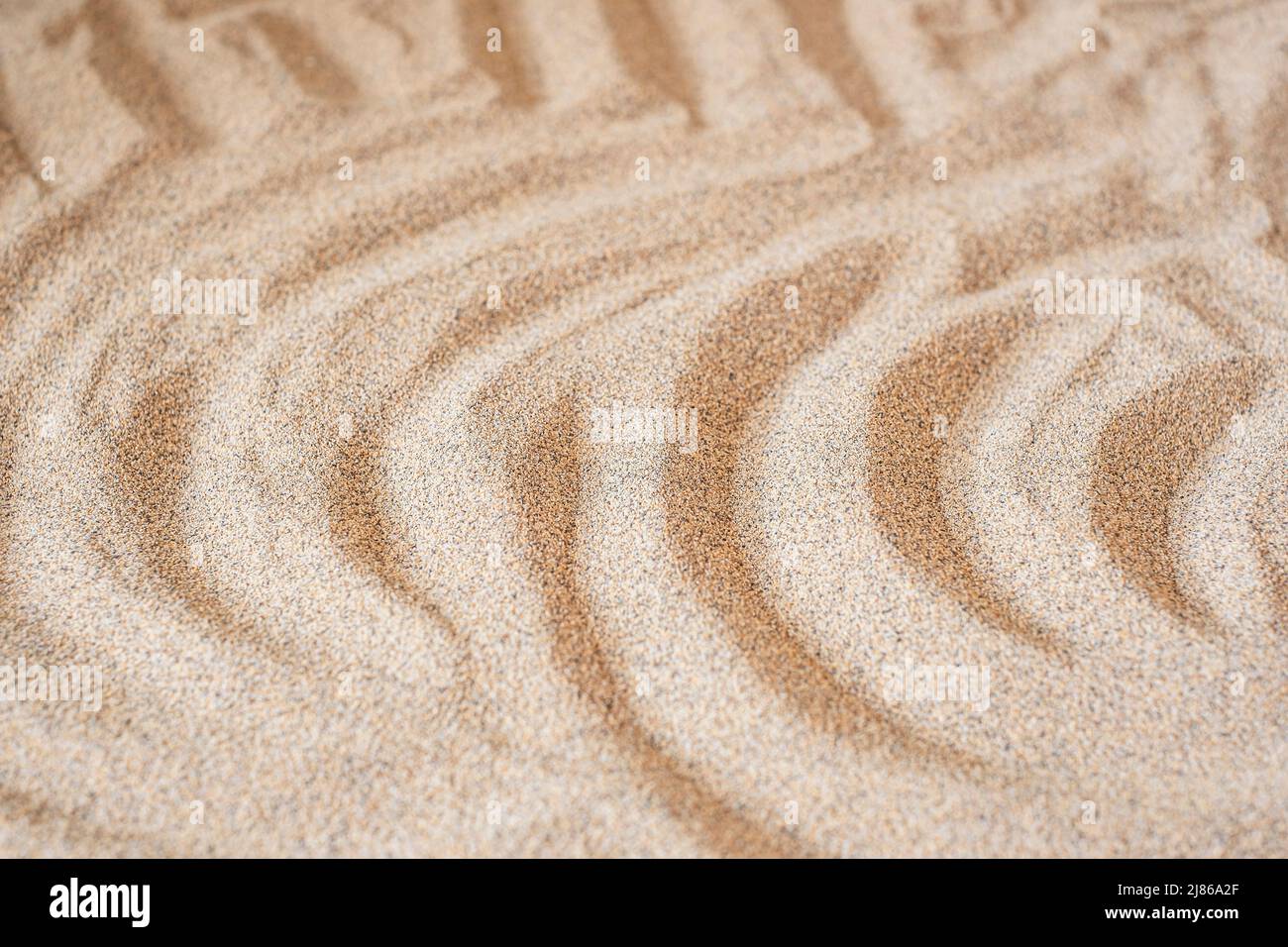 Wavy sea sand background. Flat lay. Copy space Stock Photo