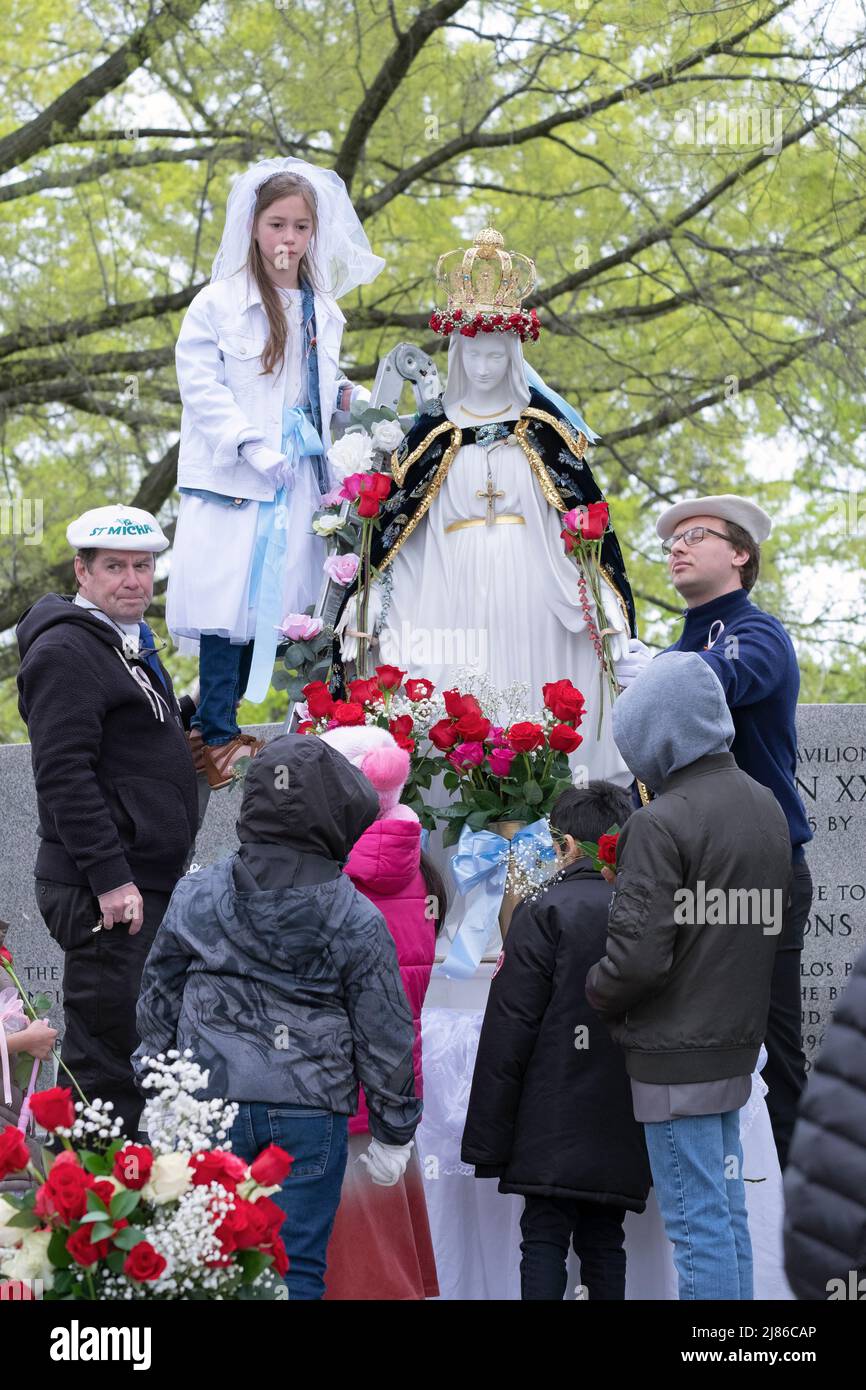 Adult & children at the May Crowning ritual on Mother's Day in a  park in Queens, New York City. Stock Photo