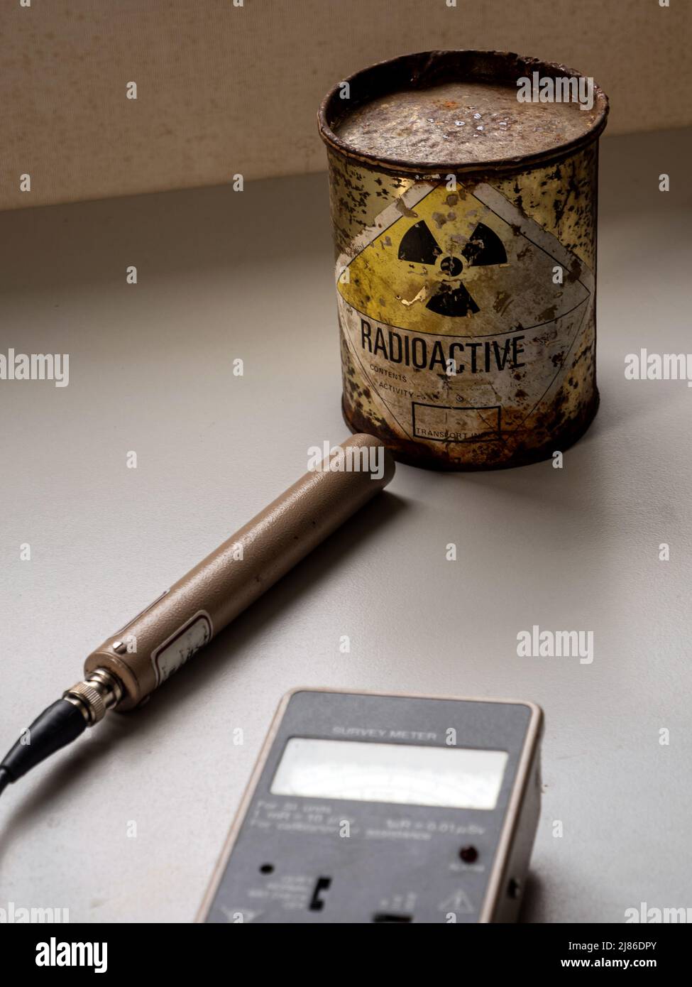 Handheld radiation survey instrument detecting radioactive material in the package. Ionizing