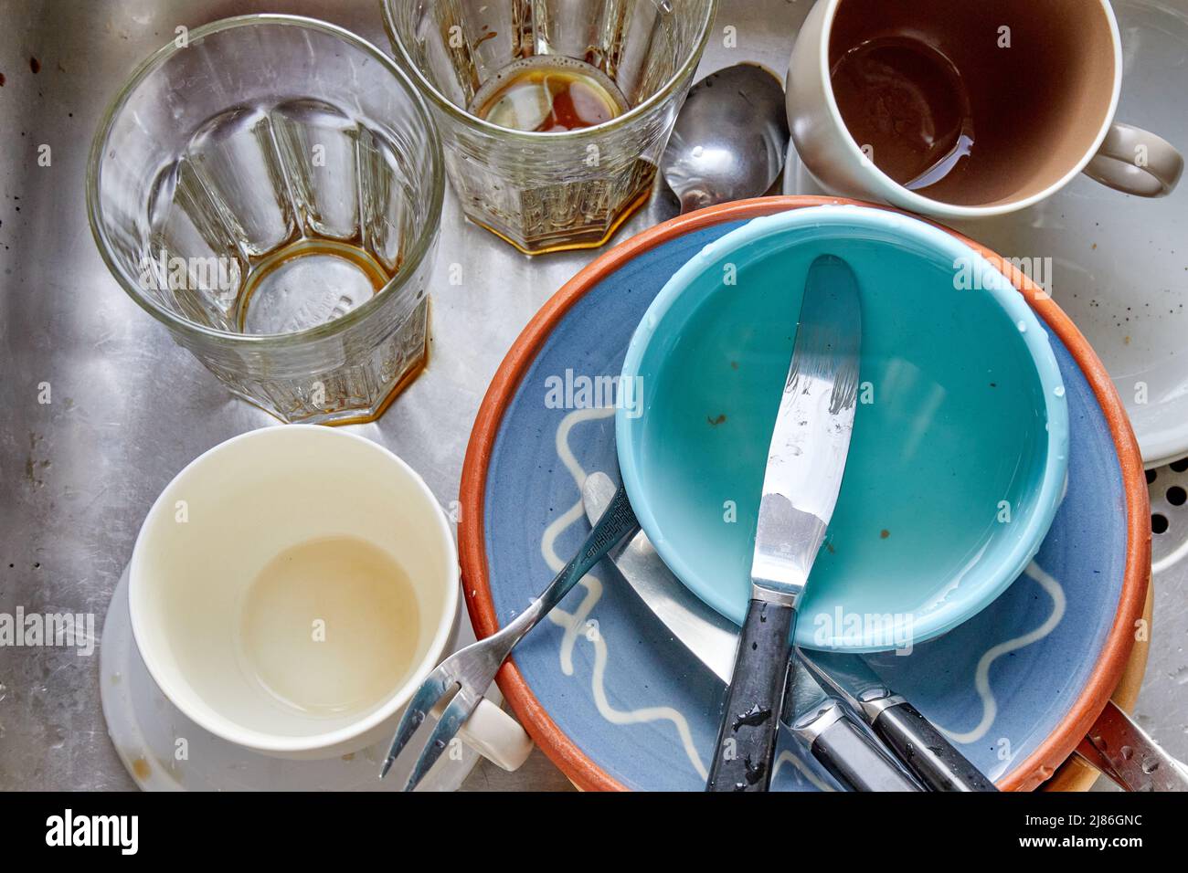 Dirty dishes, glasses, cutlery in kitchen sink Stock Photo Alamy