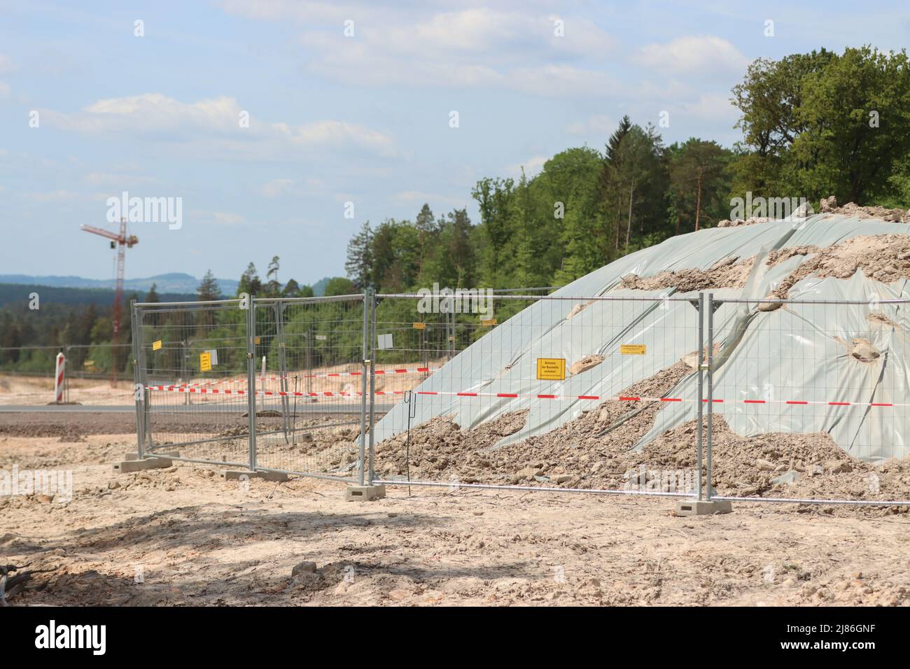 stadtallendorf-germany-13th-may-2022-covered-mounds-of-earth-on-the