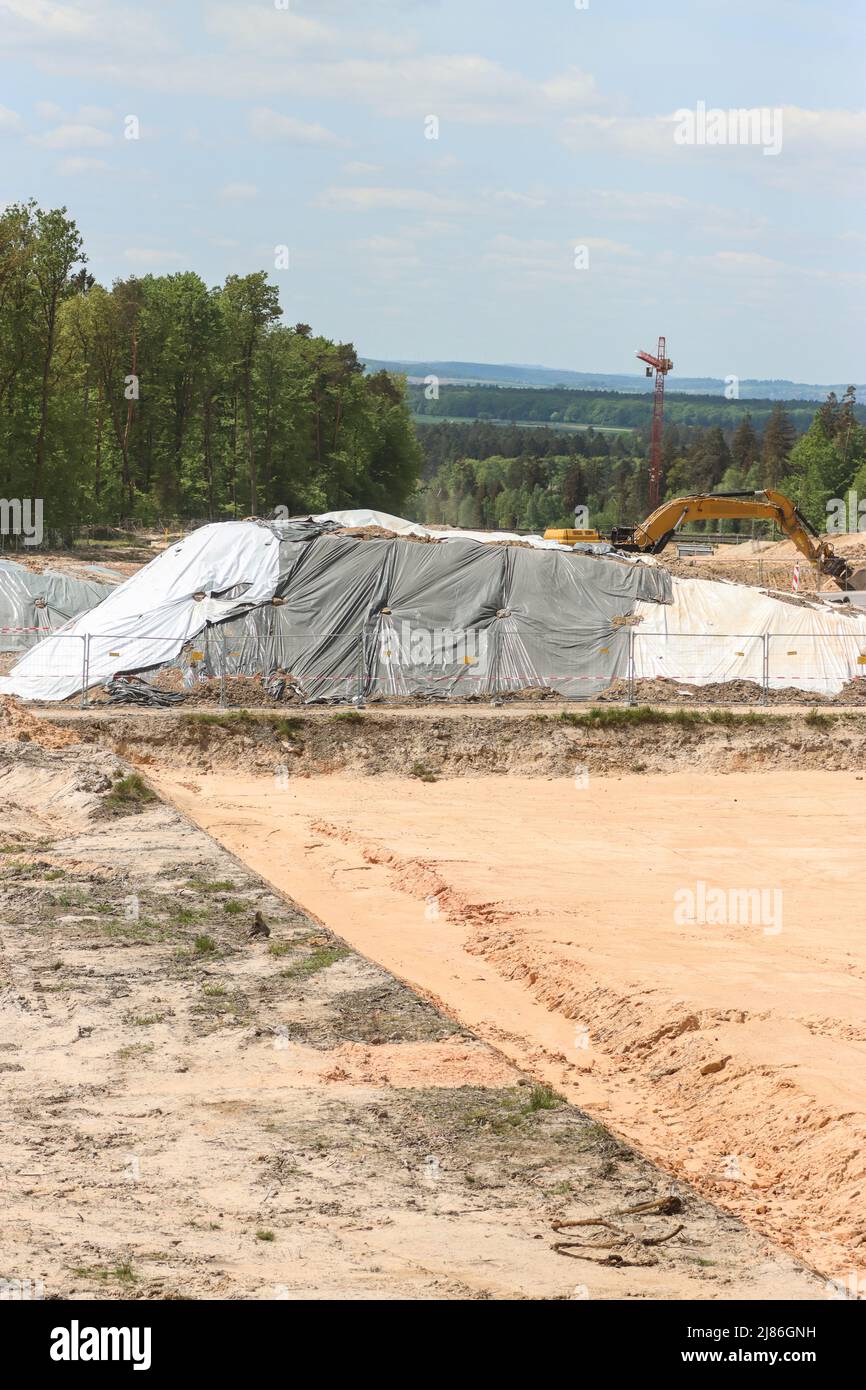 stadtallendorf-germany-13th-may-2022-covered-mounds-of-earth-on-the
