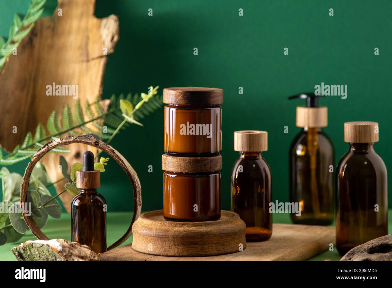 Glass brown containers for cosmetics with wooden lids. Cream jar