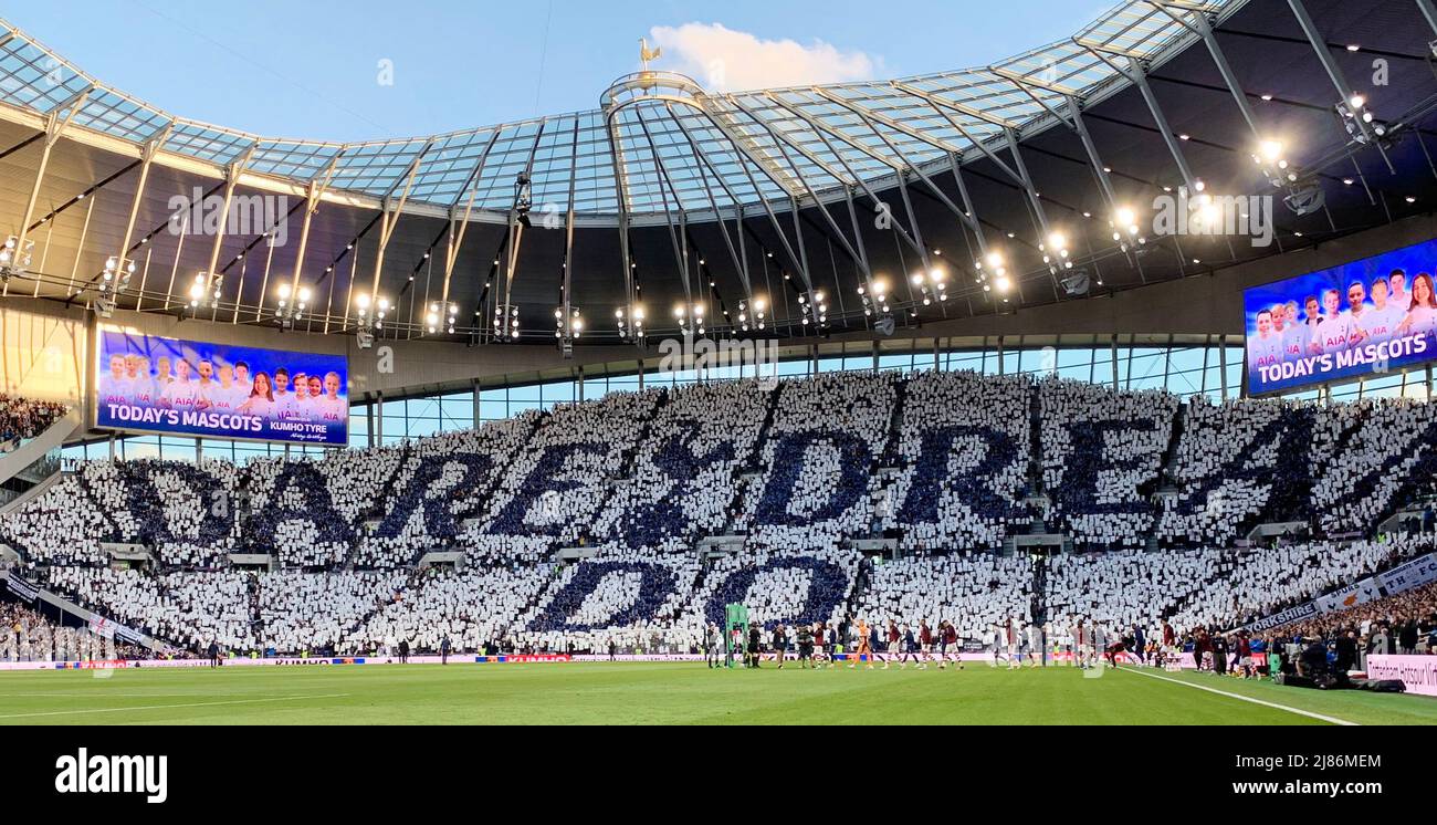 LONDON, England - MAY 12: A general view inside the stadium as fans hold up pieces of fabric to display a message of 'Dare Dream Do' prior to the Prem Stock Photo