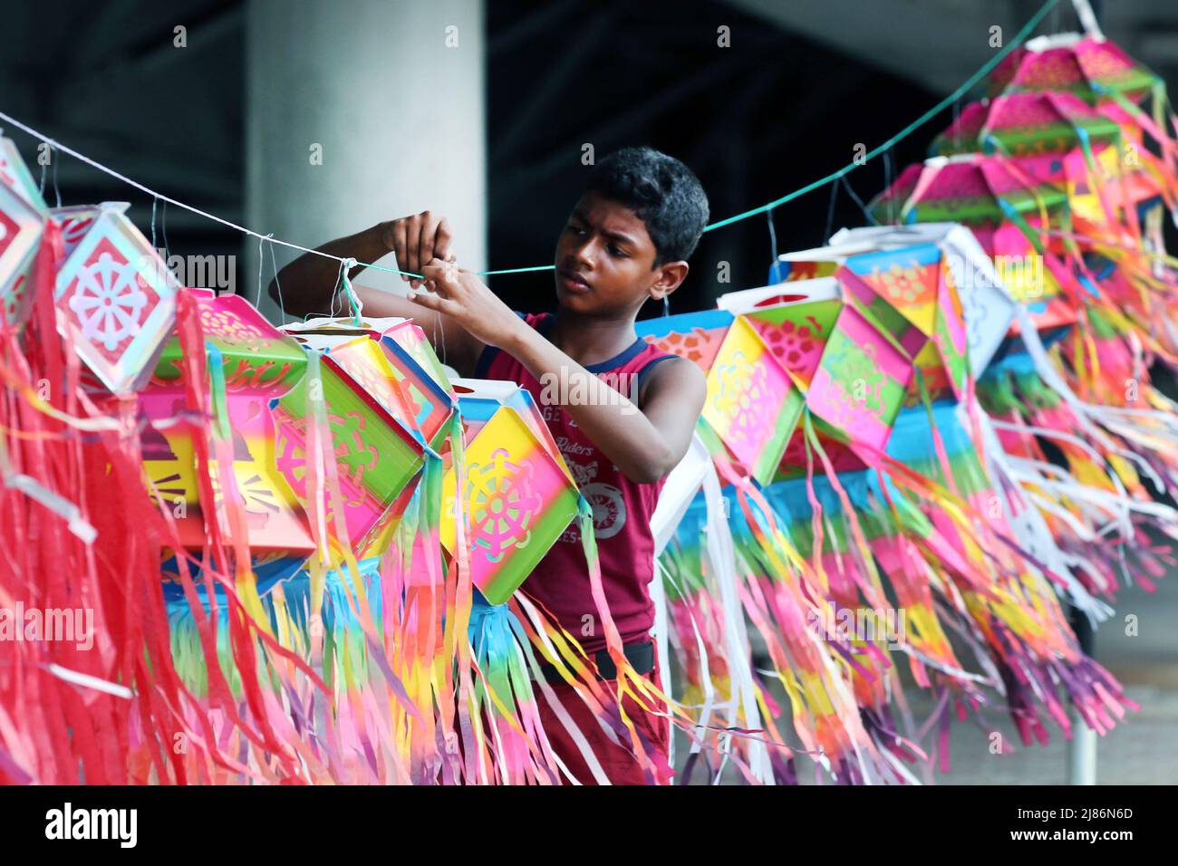 Colombo, Sri Lanka. 13th May, 2022. A vendor sells lanterns ahead of