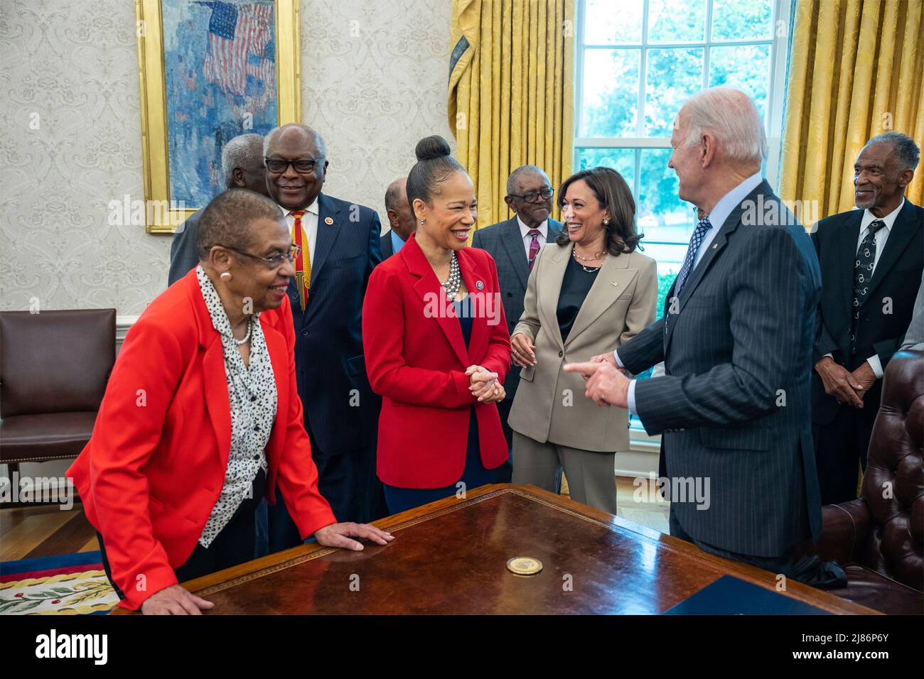 Washington, United States Of America. 13th May, 2022. Washington, United States of America. 13 May, 2022. U.S President Joe Biden, right, chats with Rep. Lisa Blunt Rochester, center, after signing the Brown v. Board of Education National Historical Park Expansion and Redesignation Act into law, in the Oval Office of the White House, May 12, 2022 in Washington, DC Also in the picture are Rep. Eleanor Holmes Norton, left, Rep. James Clyburn and Vice President Kamala Harris. Credit: Adam Schultz/White House Photo/Alamy Live News Stock Photo