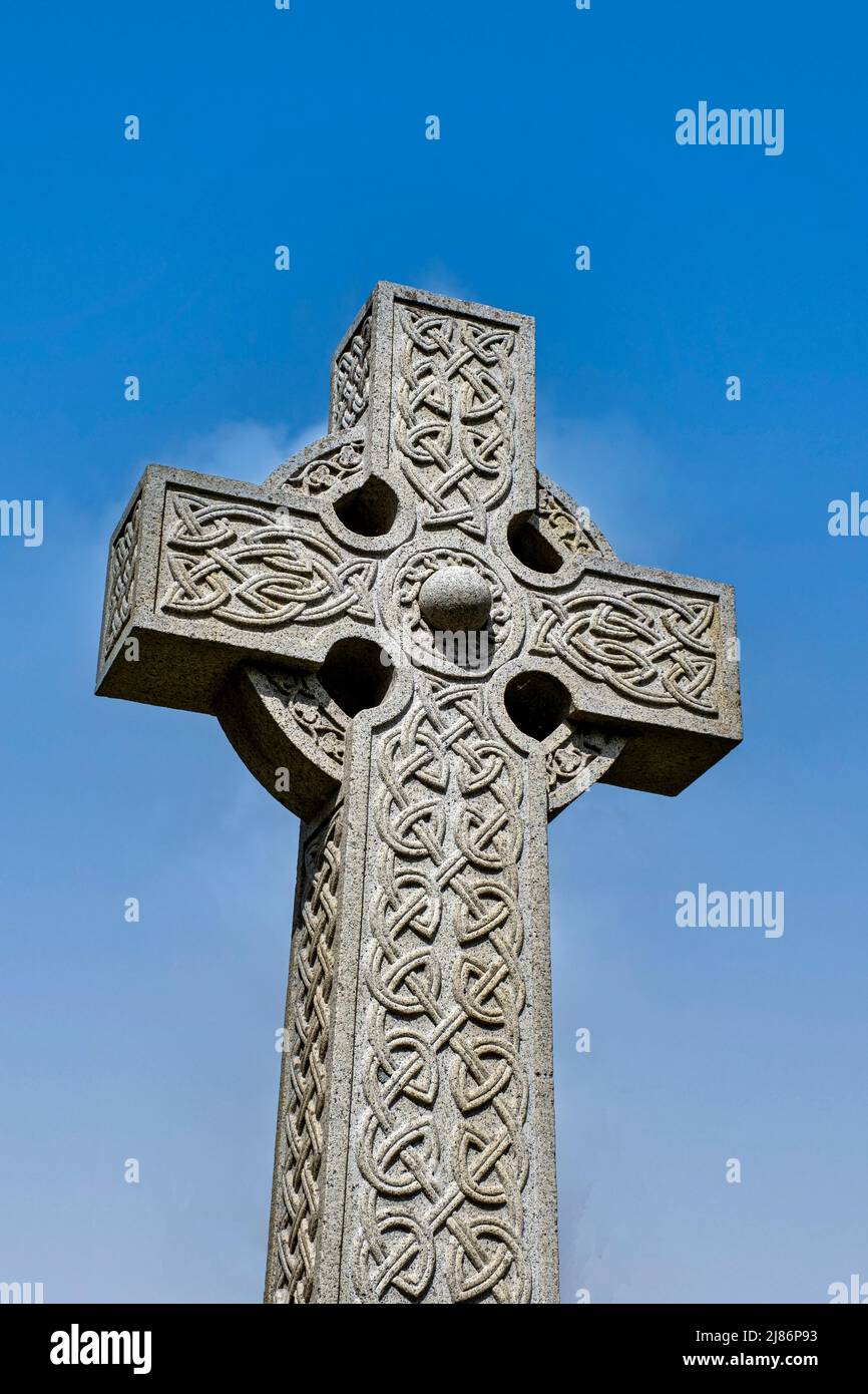 Celtic cross isolated against deep blue sky Stock Photo