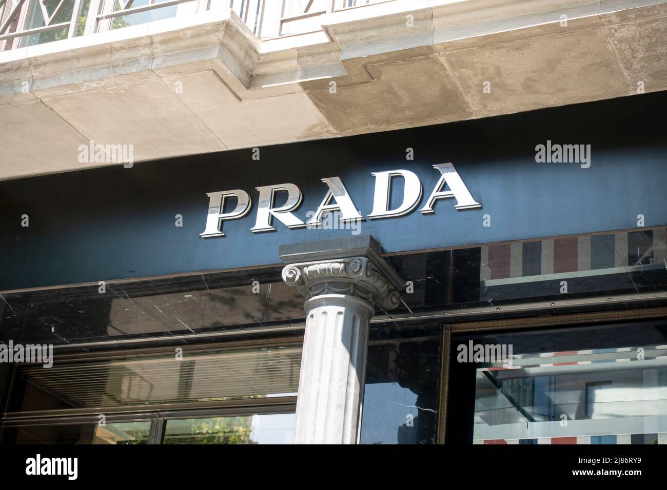 Barcelona, Spain - May 9, 2022: Prada store sign. Prada is an Italian luxury fashion house. Stock Photo