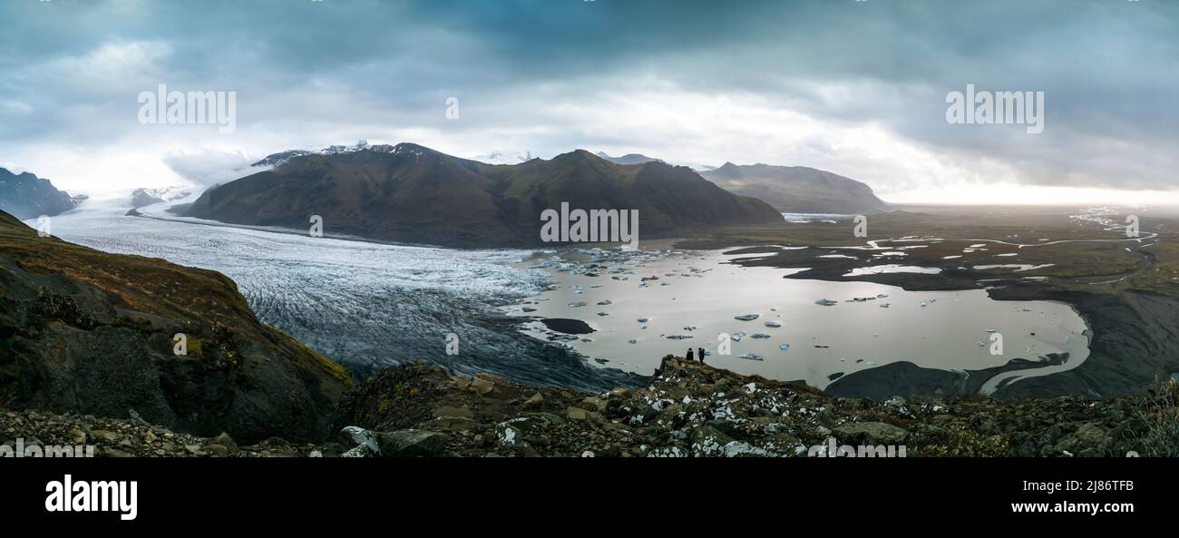 Spectacular viewpoint to massive glacier with tourists Stock Photo