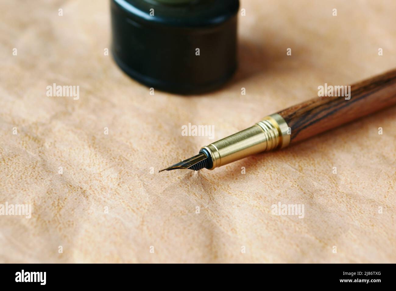 old empty paper and fountain pen on table  Stock Photo
