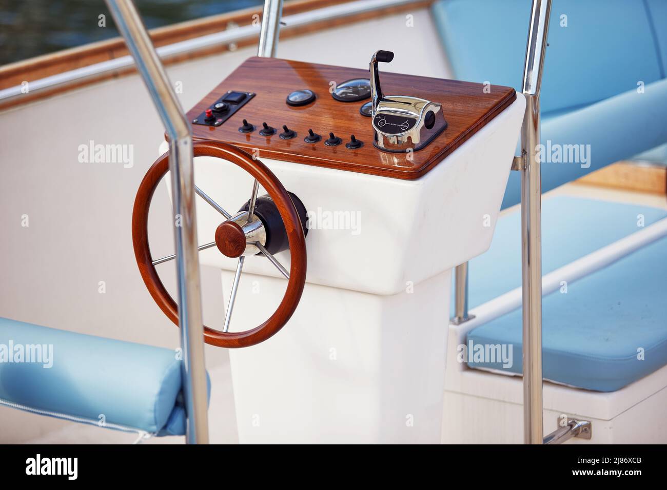 Close-up view of the yacht steering wheel on a beautiful sunny day on the sea. Yacht, sea, summer Stock Photo