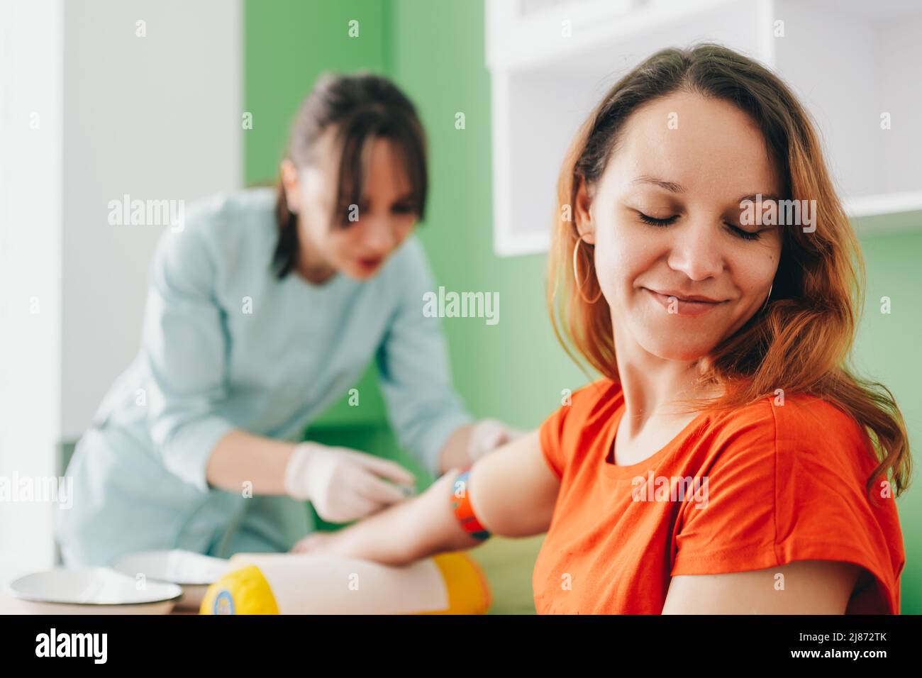 Blood test. The patient turned his head from the injection Stock Photo