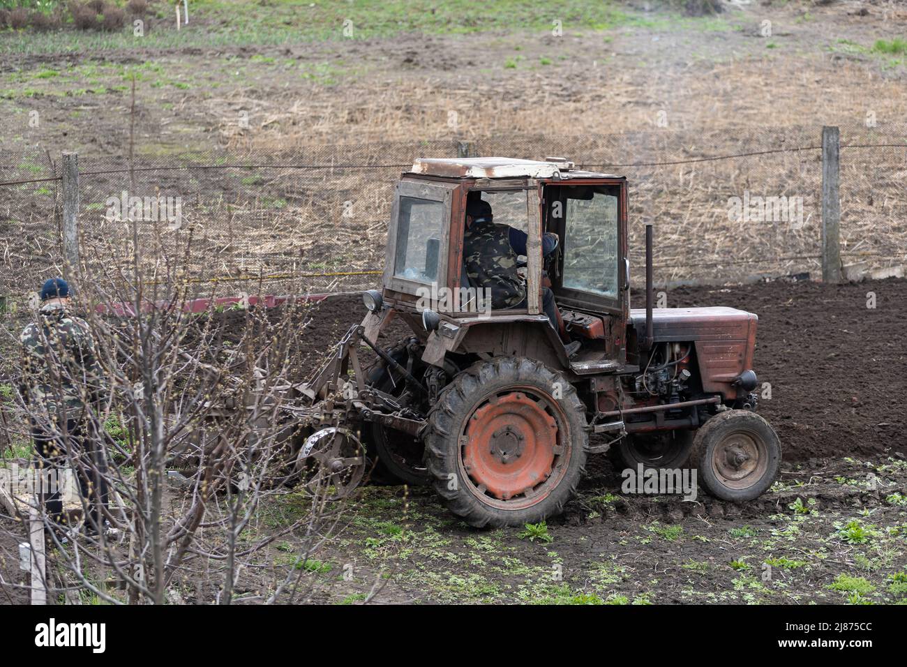 Old tractor riding in the highlands. Agriculture Stock Photo - Alamy