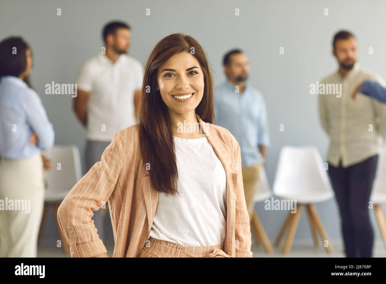 Portrait of happy successful beautiful businesswoman or professional business coach Stock Photo