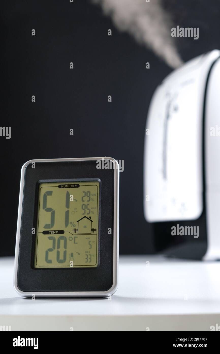 Hygrometer and thermometer with humidifier. Maintenance of normal air