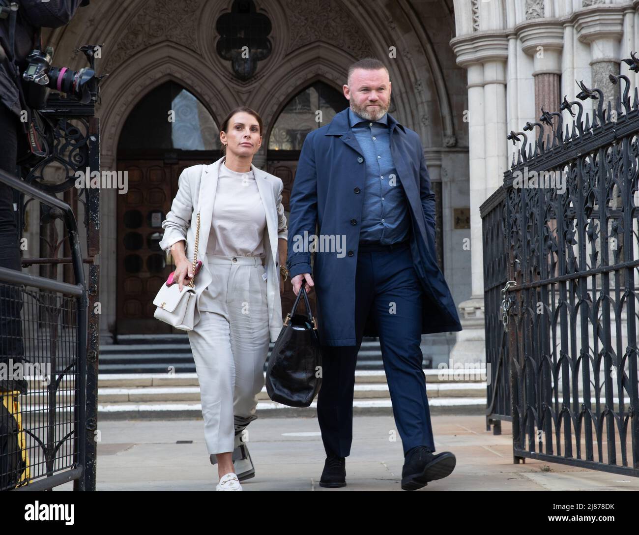 London, UK. 13th May, 2022. Coleen Rooney leaves The Royal Courts of Justice after her libel case with Rebekah Vardy, Coleen Rooney who is the wife of Derby County manager and former England football player Wayne Rooney, and Rebekah Vardy, wife of Leicester City striker Jamie Vardy are locked in a libel battle also known as the 'Wagatha Christie' trial after accusations that Mrs Vardy leaked false stories about Mrs Rooney to the press. Credit: Lucy North/Alamy Live News Stock Photo